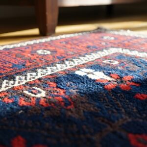 Antique Allover Tribal Floral Pattern Persian Baluch Rug (SKU 24282) - in-room detail