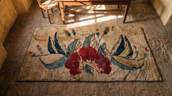 Antique american folk art red rose pattern hooked rug (sku 20525) - styled overhead view