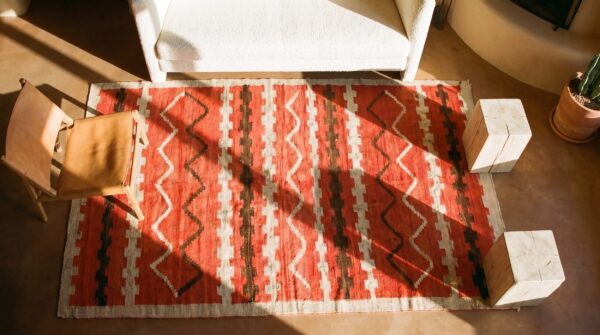 Antique american navajo rug 4'4"×7'2" bright red ground, ivory border, transitional period, circa 1890 2 Antique american navajo rug 4'4"×7'2" bright red ground, ivory border, transitional period, circa 1890 (sku 20941) - styled overhead view