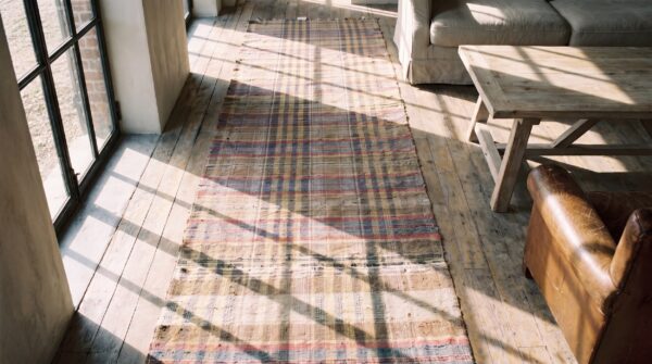 Antique american rag rug hallway runner wool & cotton multicolor (sku 20589) - styled overhead view