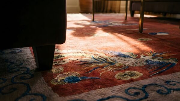 Antique art deco chinese allover medallion red knotted rug (sku 24179) - in-room detail