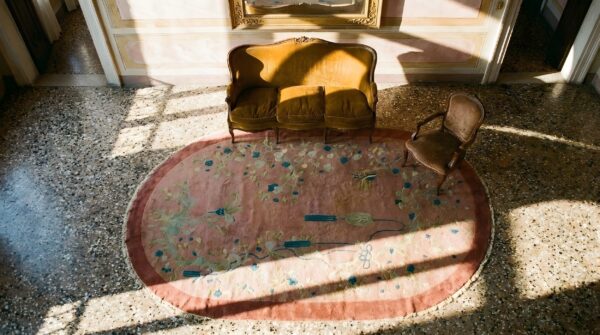 Antique art deco chinese oval coral area rug - artistic design (sku 24165) - styled overhead view