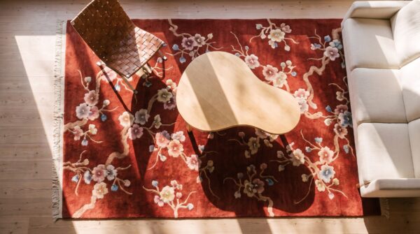 Antique art deco small scatter size wool red rug (sku 24186) - styled overhead view