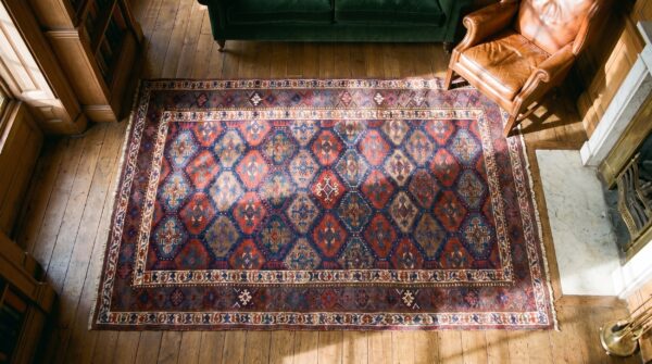 Blue antique allover tribal design persian kurdish area rug 2 Blue antique allover tribal design persian kurdish area rug (sku 18911) - styled overhead view