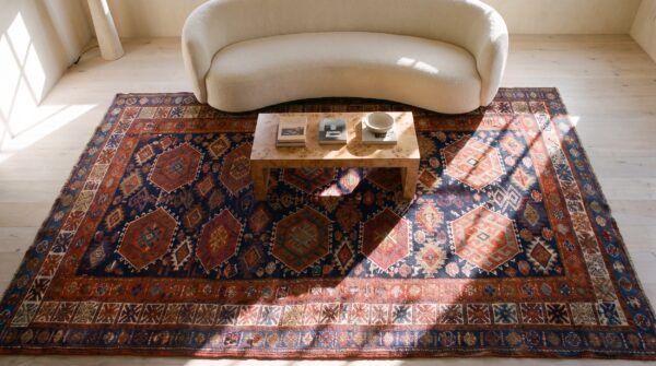 Blue background antique persian tribal geometric jewel ton color design kurdish rug 2 Blue background antique persian tribal geometric jewel ton color design kurdish rug (sku 21800) - styled overhead view