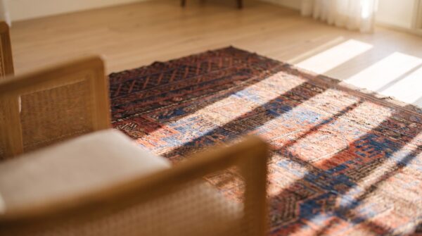 Blue bold tribal design antique wool pile persian baluch rug 12 Blue bold tribal design antique wool pile persian baluch rug (sku 24181) - in-room detail