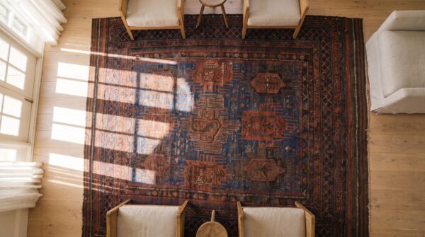 Blue bold tribal design antique wool pile persian baluch rug 2 Blue bold tribal design antique wool pile persian baluch rug (sku 24181) - styled overhead view
