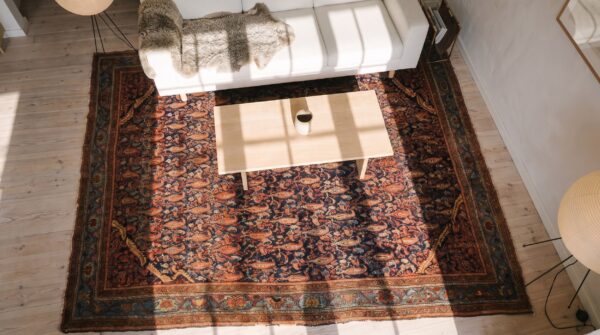 Antique blue paisley pattern square persian malayer rug (sku 24857) - styled overhead view