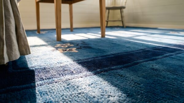 Hand knotted pile blue rectangle 1930s wool antique floral rug (sku 25755) - in-room detail