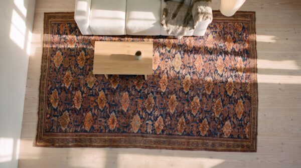 Blue tribal design mid 19th century antique turkish oushak rug (sku 25079) - styled overhead view