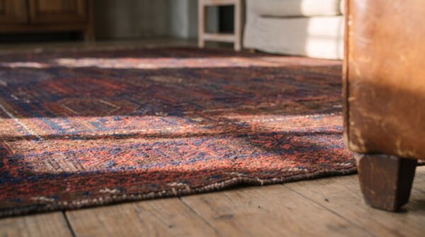 Blue tribal antique late 19th century afghan baluch rug 12 Blue tribal antique late 19th century afghan baluch rug (sku 22383) - in-room detail