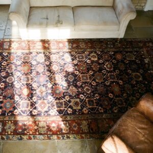 Blue Tribal Long and Narrow Antique Mid 19th Century Caucasian Shirvan Rug (SKU 24964) - styled overhead view