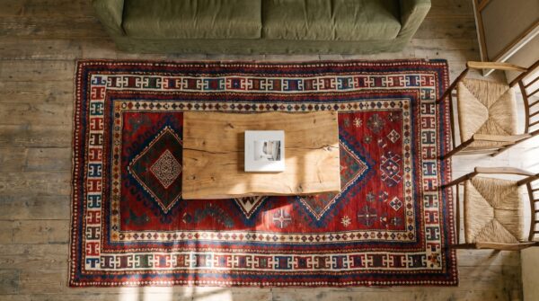 Bold bright red antique late 19th century tribal geometric caucasian kazak rug 2 Bold bright red antique late 19th century tribal geometric caucasian kazak rug (sku 19293) - styled overhead view