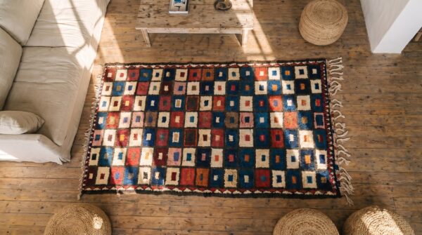 Bold colorful tribal geometric checkerboard design antique persian gabbeh rug 2 Bold colorful tribal geometric checkerboard design antique persian gabbeh rug (sku 19181) - styled overhead view