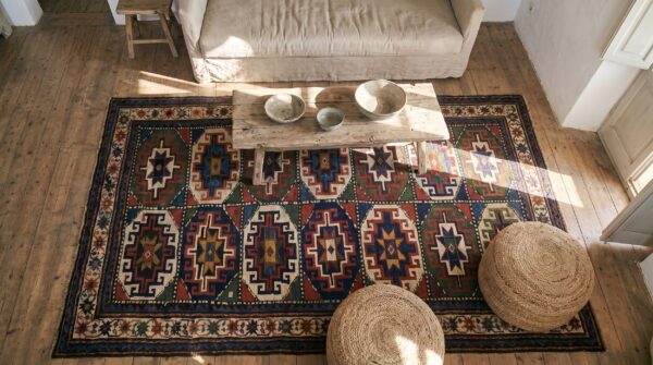 Bold graphic tribal grid pattern antique caucasian moghan area rug 2 Bold graphic tribal grid pattern antique caucasian moghan area rug (sku 19608) - styled overhead view