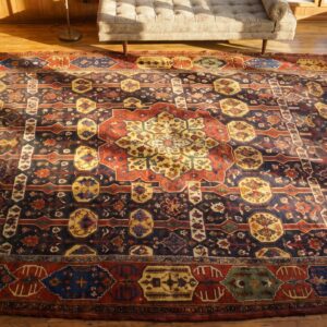 Bold Late 19th Century Antique Colorful Persian Tribal Bakhtiari Oversized Carpet (SKU 18799) - styled overhead view
