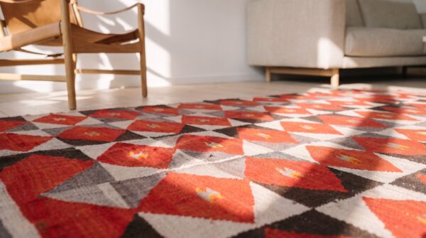 Antique bold red primitive tribal geometric native american flatweave navajo rug 7 Antique bold red primitive tribal geometric native american flatweave navajo rug (sku 21182) - in-room detail