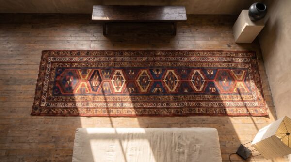 Bold antique tribal geometric nw persian kurdish hallway runner rug 2 Bold antique tribal geometric nw persian kurdish hallway runner rug (sku 21015) - styled overhead view