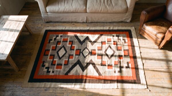 Bold tribal antique native american geometric flatwoven navajo rug 2 Bold tribal antique native american geometric flatwoven navajo rug (sku 21702) - styled overhead view
