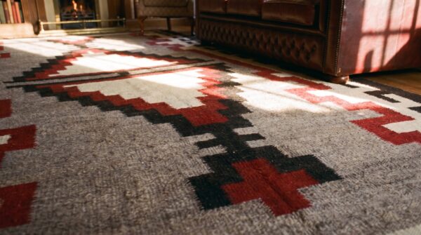 Antique bold tribal pattern native american gray flatwoven navajo rug (sku 24448) - in-room detail