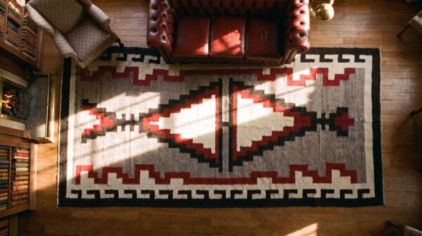 Antique bold tribal pattern native american gray flatwoven navajo rug (sku 24448) - styled overhead view