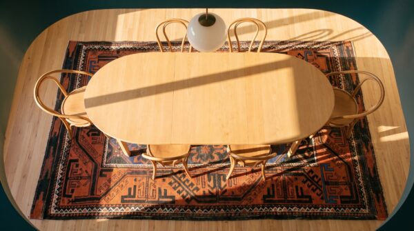 Bold tribal antique small scatter size persian baluch area rug (sku 21646) - styled overhead view
