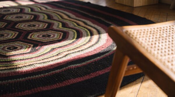 Antique braided american flat weave oval rug (sku 17350) - in-room detail