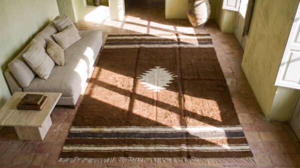 Brown color tribal geometric antique flatweave turkish kilim medallion rug 2 Brown color tribal geometric antique flatweave turkish kilim medallion rug (sku 19141) - styled overhead view