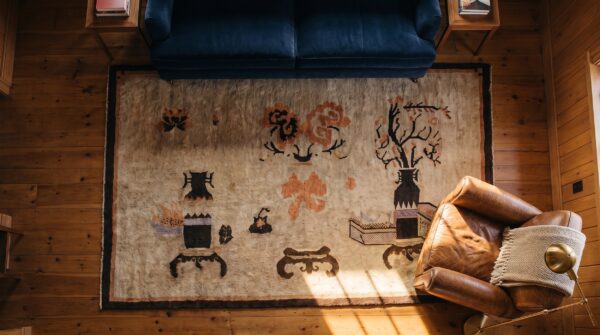Brown earth tone antique hand knotted pile chinese baotou rug 2 Brown earth tone antique hand knotted pile chinese baotou rug (sku 25278) - styled overhead view