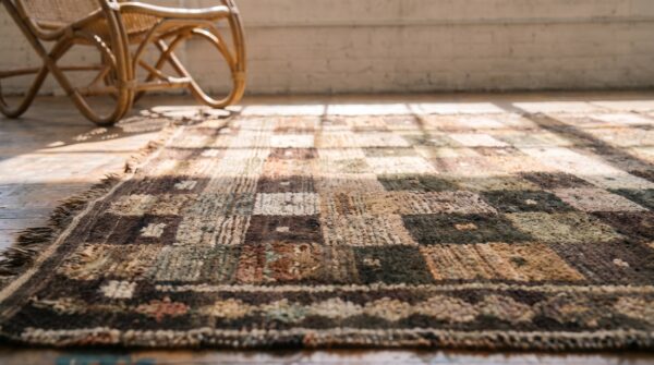Brown antique tribal geometric checkerboard pattern wool persian gabbeh rug 8 Brown antique tribal geometric checkerboard pattern wool persian gabbeh rug (sku 18929) - in-room detail