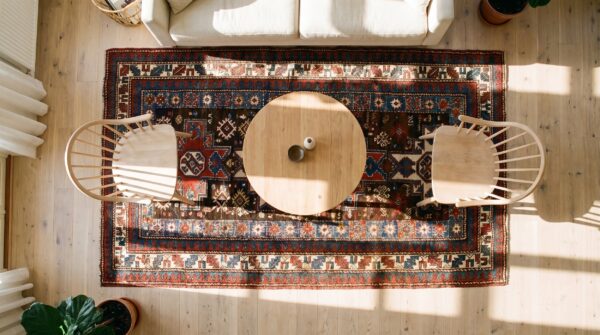 Antique caucasian rug 4'×8' brown tribal geometric, 1890s (sku 19104) - styled overhead view