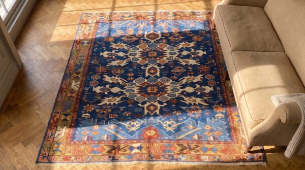 Antique caucasian bidjov small scatter size wool blue rug (sku 24514) - styled overhead view