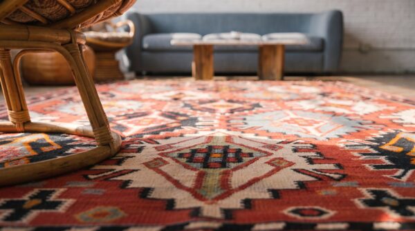 Antique caucasian - kilim caucasian knotted rug in coral (sku 22492) - in-room detail