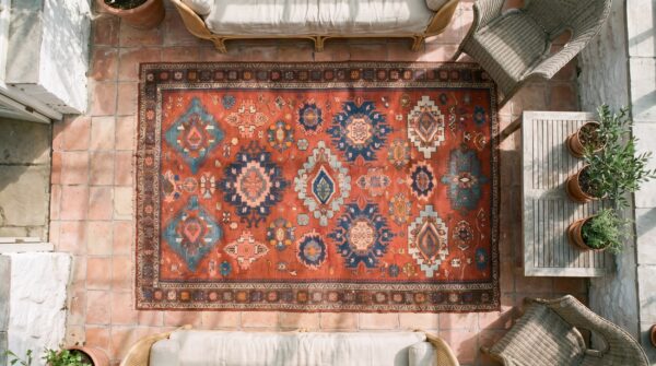 Antique caucasian - sumak small scatter size wool coral rug 2 Antique caucasian - sumak small scatter size wool coral rug (sku 19921) - styled overhead view