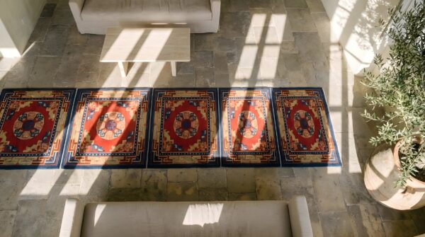 Antique chinese baotou hallway runner wool red rug (sku 22483) - styled overhead view
