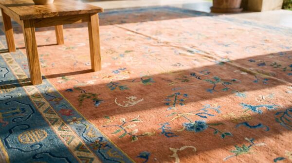 Chinese wool rectangle knotted 1920s room size - art deco antique coral rug (sku 25718) - in-room detail
