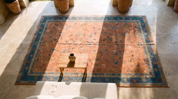Chinese wool rectangle knotted 1920s room size - art deco antique coral rug (sku 25718) - styled overhead view