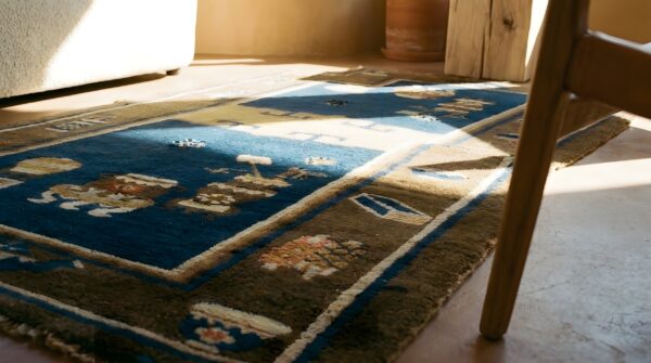 Antique chinese saddle rug horse cover wool navy and brown carpet (sku 23824) - in-room detail