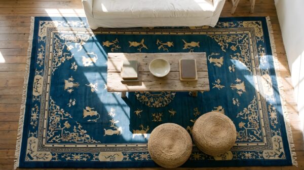 Classic floral medallion design light blue antique chinese peking rug (sku 22804) - styled overhead view