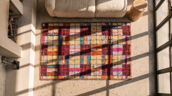 Colorful antique geometric american folk art plaid pattern hooked rug 2 Colorful antique geometric american folk art plaid pattern hooked rug (sku 20514) - styled overhead view