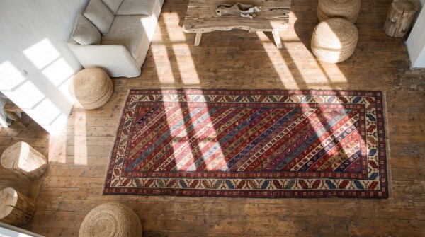 Antique colorful tribal stripe caucasian shirvan hallway runner rug (sku 18632) - styled overhead view