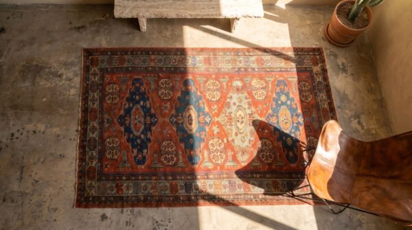 Antique coral caucasian flatweave rustic tribal soumak area rug 2 Antique coral caucasian flatweave rustic tribal soumak area rug (sku 18577) - styled overhead view