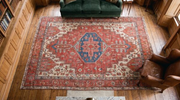 Antique coral heriz serapi persian geometric medallion hand knotted wool pile rug 2 Antique coral heriz serapi persian geometric medallion hand knotted wool pile rug (sku 20932) - styled overhead view