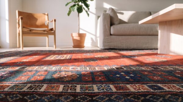 Coral antique long and narrow caucasian kazak knotted wool pile rug 10 Coral antique long and narrow caucasian kazak knotted wool pile rug (sku 21082) - in-room detail