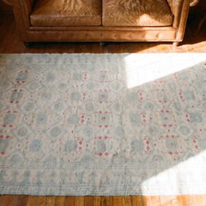 Decorative Light Faded Ivory Color Antique Indian Tribal Floral Design Cotton Agra Rug (SKU 20362) - styled overhead view