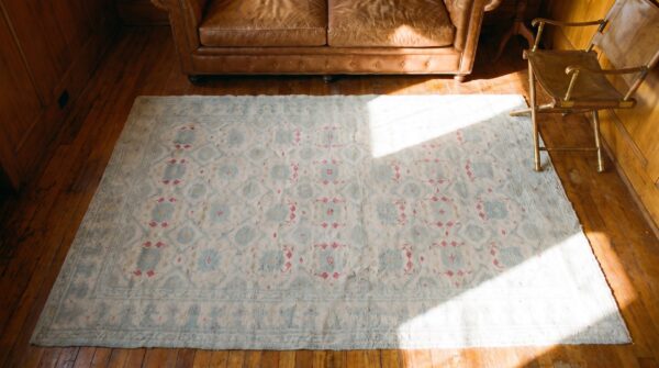 Decorative light faded ivory color antique indian tribal floral design cotton agra rug 2 Decorative light faded ivory color antique indian tribal floral design cotton agra rug (sku 20362) - styled overhead view
