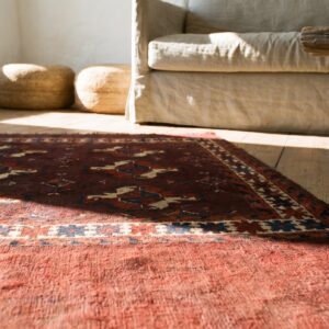 Antique Deep Red Field Late 19th Century Turkmen Repeating Tribal Geometric Guls Tekke Rug (SKU 18349) - in-room detail