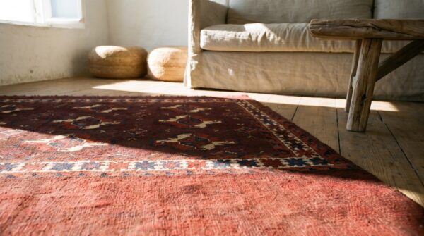 Antique deep red field late 19th century turkmen repeating tribal geometric guls tekke rug (sku 18349) - in-room detail