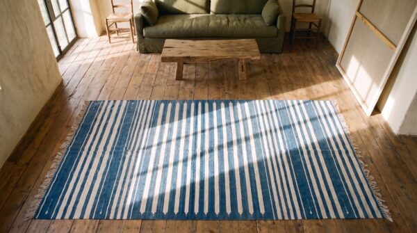 Early 20th century blue white stripes antique indian cotton dhurrie flatweave rug 2 Early 20th century blue white stripes antique indian cotton dhurrie flatweave rug (sku 21064) - styled overhead view