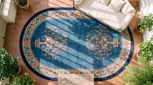 Antique early 20th century light blue chinese peking oval rug 2 Antique early 20th century light blue chinese peking oval rug (sku 23275) - styled overhead view